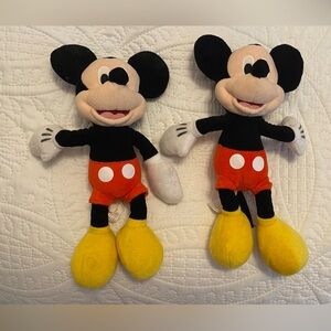 Two Mickey Mouse stuffed animals